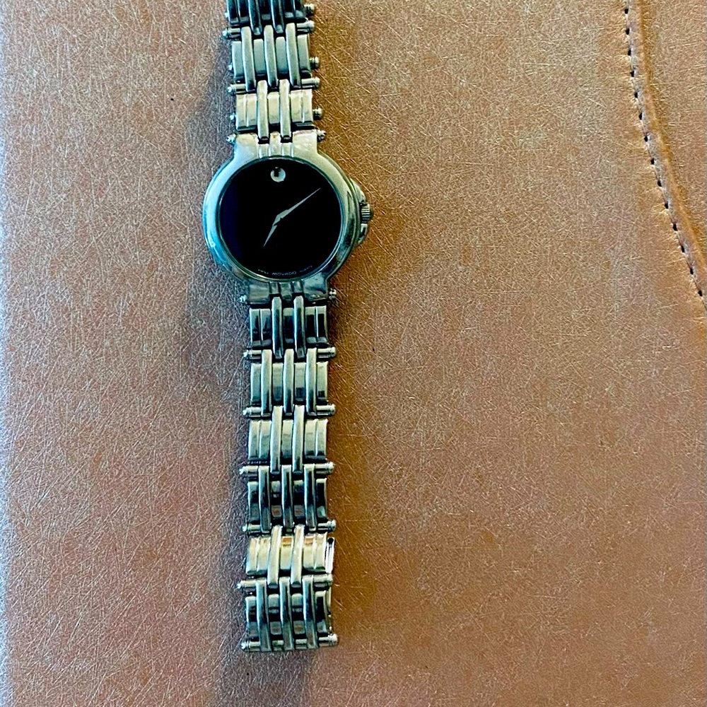 Movado black faced watch with silver band - Picture 2 of 3